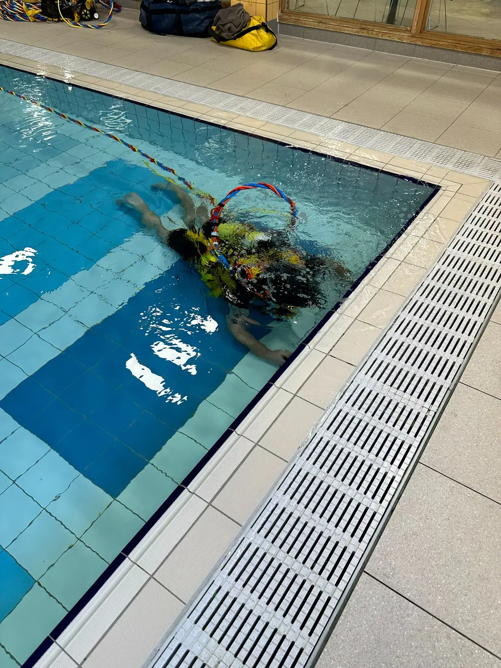 Commercial diver working in a controlled inland facility